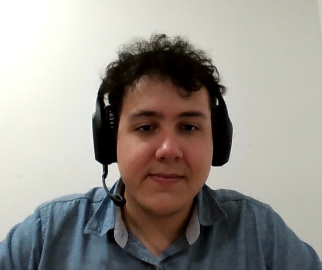 Picture of me smiling with headphones on.